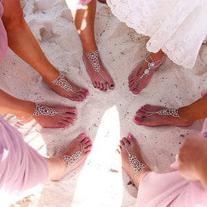 Girls wearing barefoot sandals on the beach